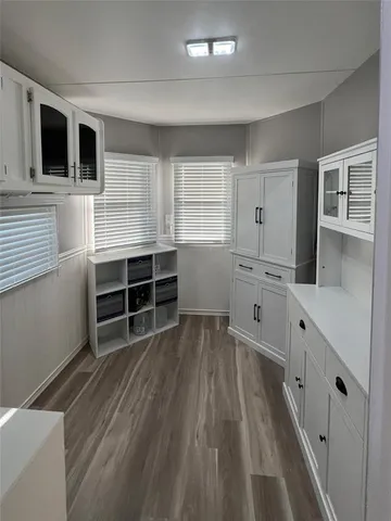 a kitchen with stainless steel appliances a stove and more cabinets