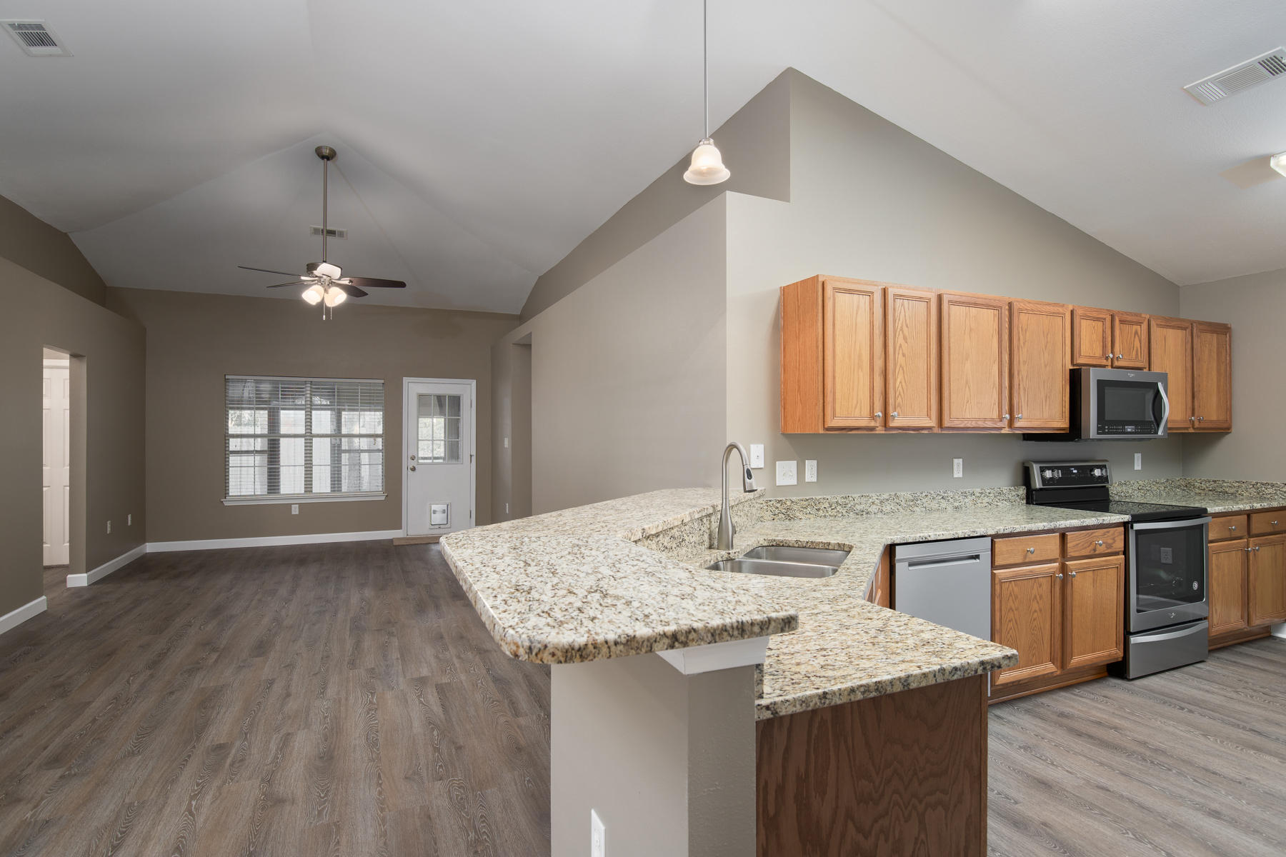 199 Bayou Landing Road Miramar Beach, FL 32550 - Photo 1 of 19 a kitchen with a center island wooden floor and a window
