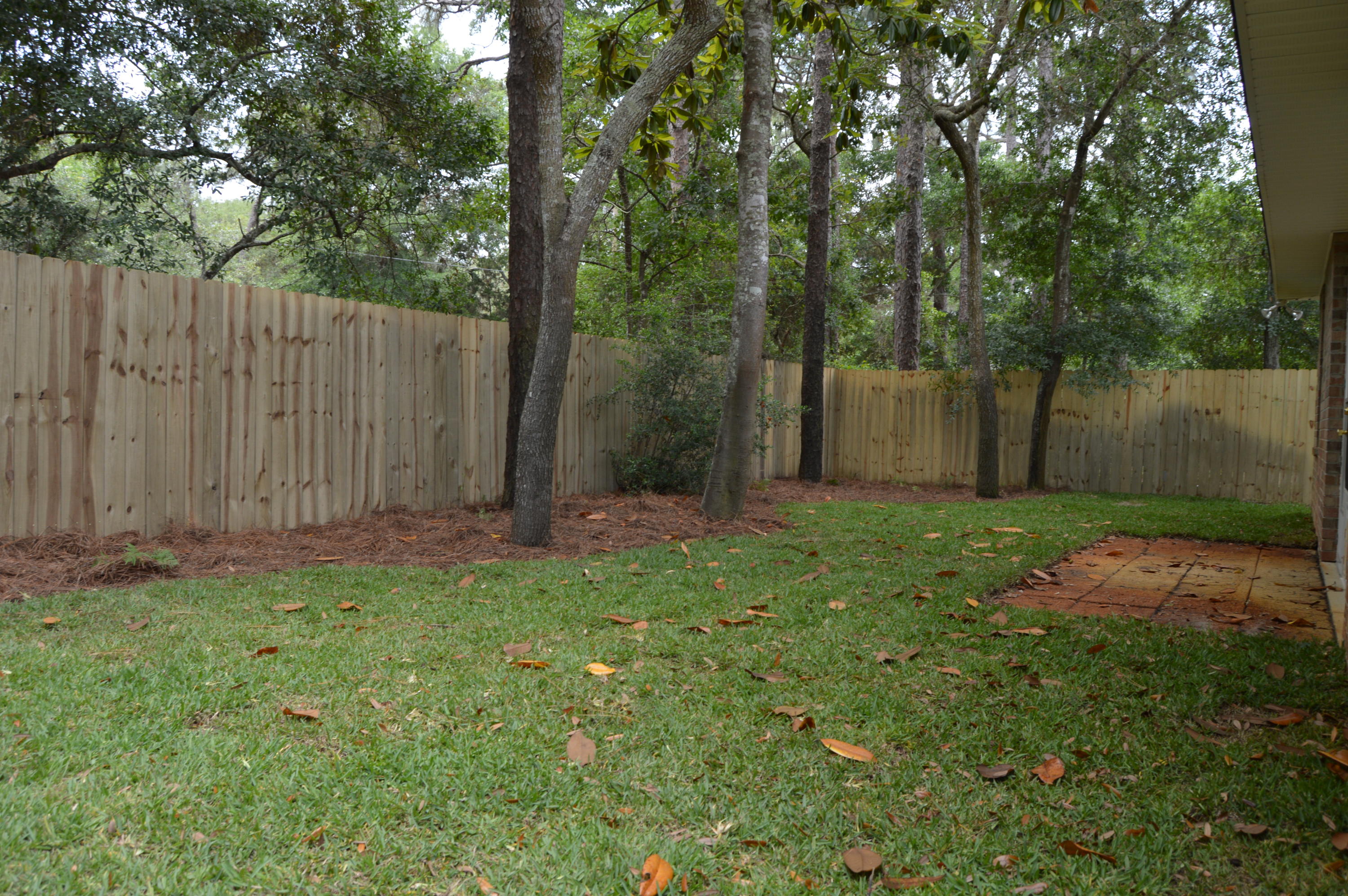199 Bayou Landing Road Miramar Beach, FL 32550 - Photo 17 of 19 a backyard of a house with lots of green space