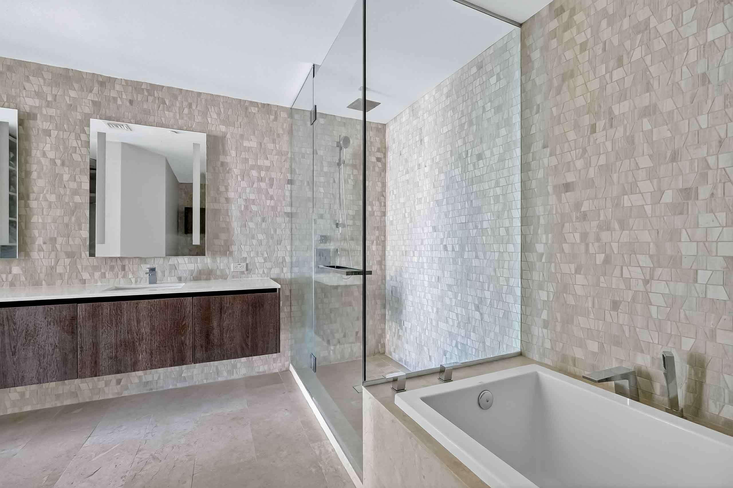 88 Southwest 7th Street, Unit 3003 Miami, FL 33130 - Photo 19 of 49 a bathroom with a bathtub and a shower