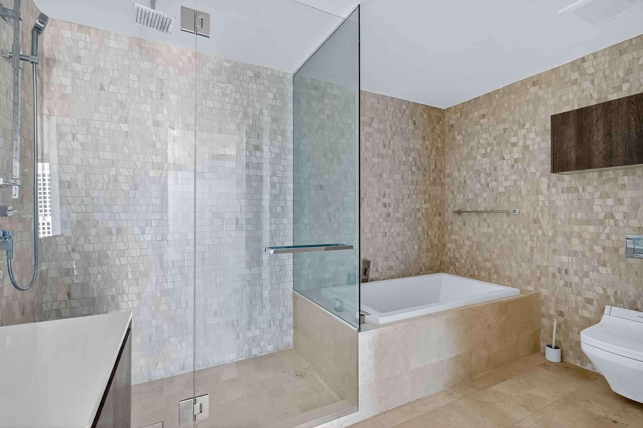 88 Southwest 7th Street, Unit 3003 Miami, FL 33130 - Photo 20 of 49 a bathroom with a bathtub and a shower