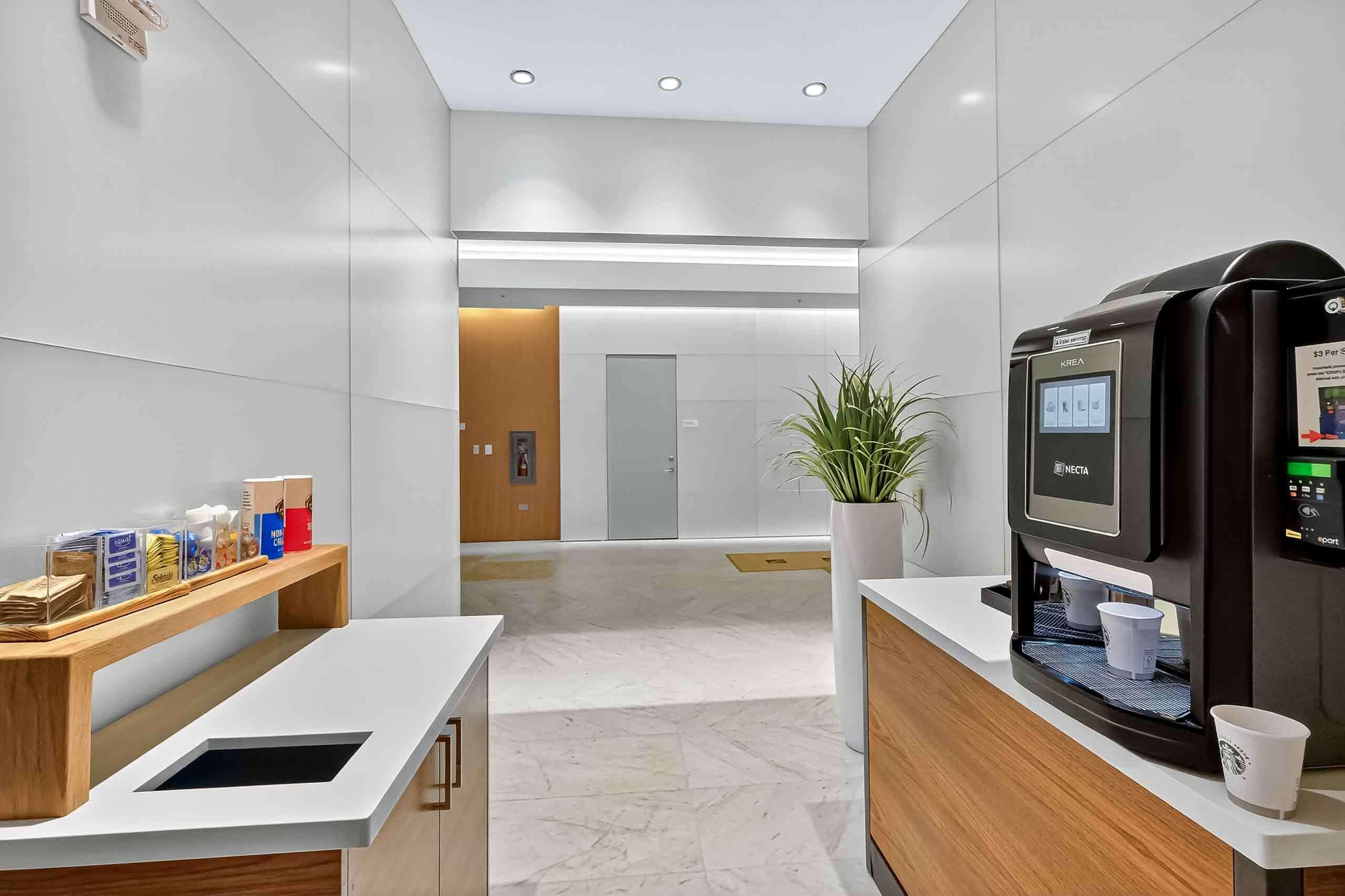 88 Southwest 7th Street, Unit 3003 Miami, FL 33130 - Photo 31 of 49 a kitchen with kitchen island and appliances