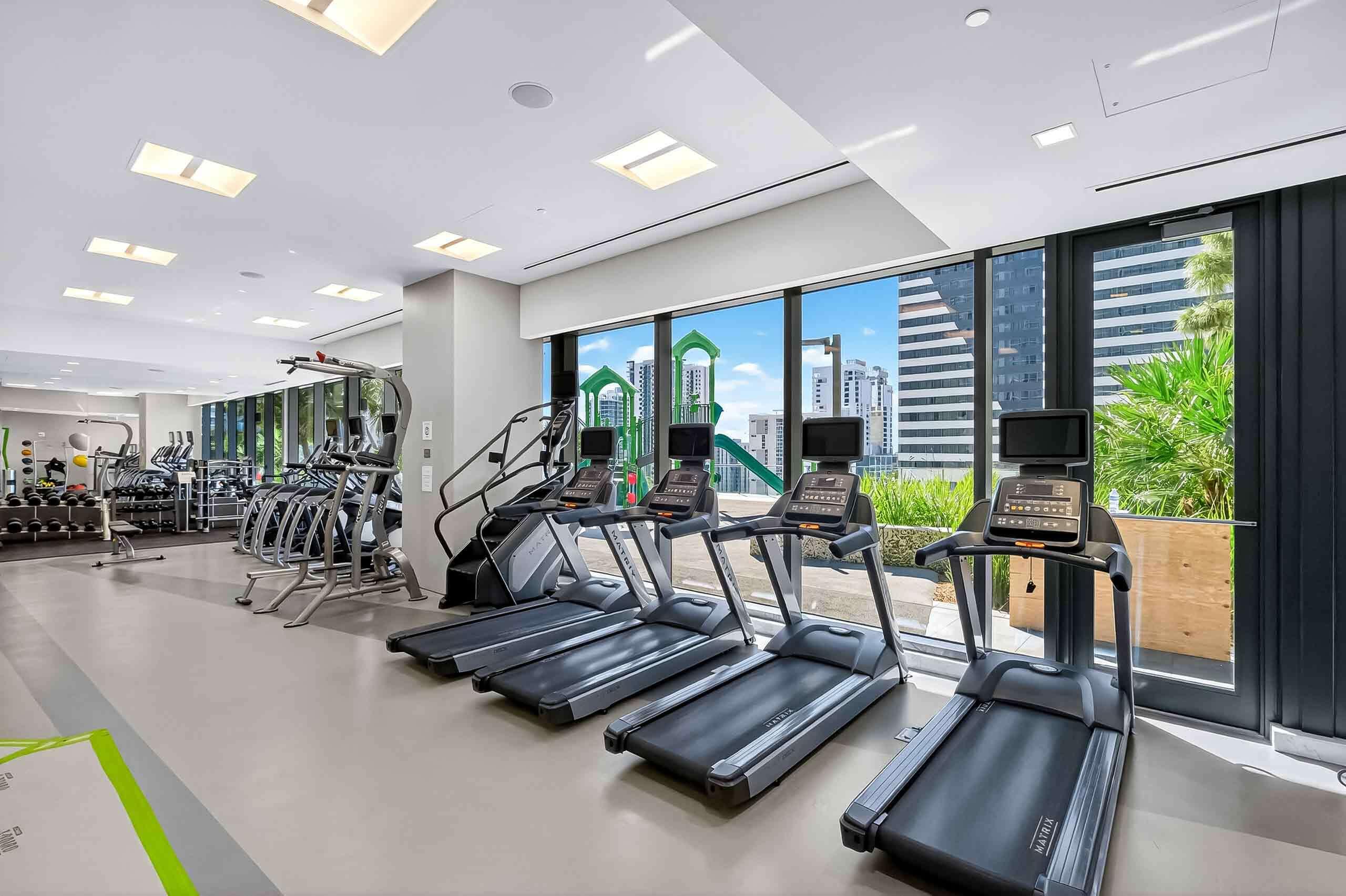 88 Southwest 7th Street, Unit 3003 Miami, FL 33130 - Photo 32 of 49 a view of a room with gym equipment