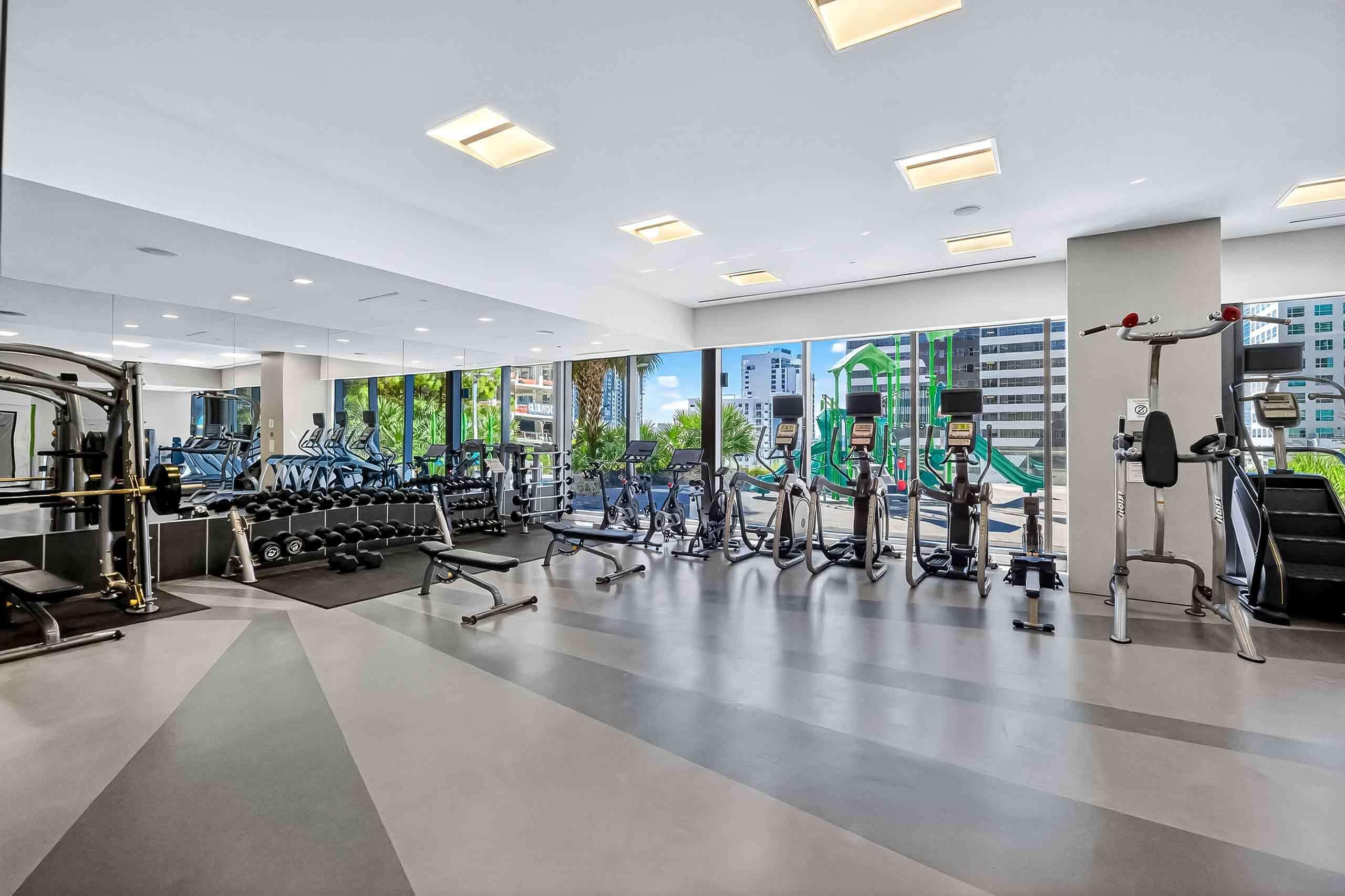 88 Southwest 7th Street, Unit 3003 Miami, FL 33130 - Photo 33 of 49 a lobby with furniture and floor to ceiling window