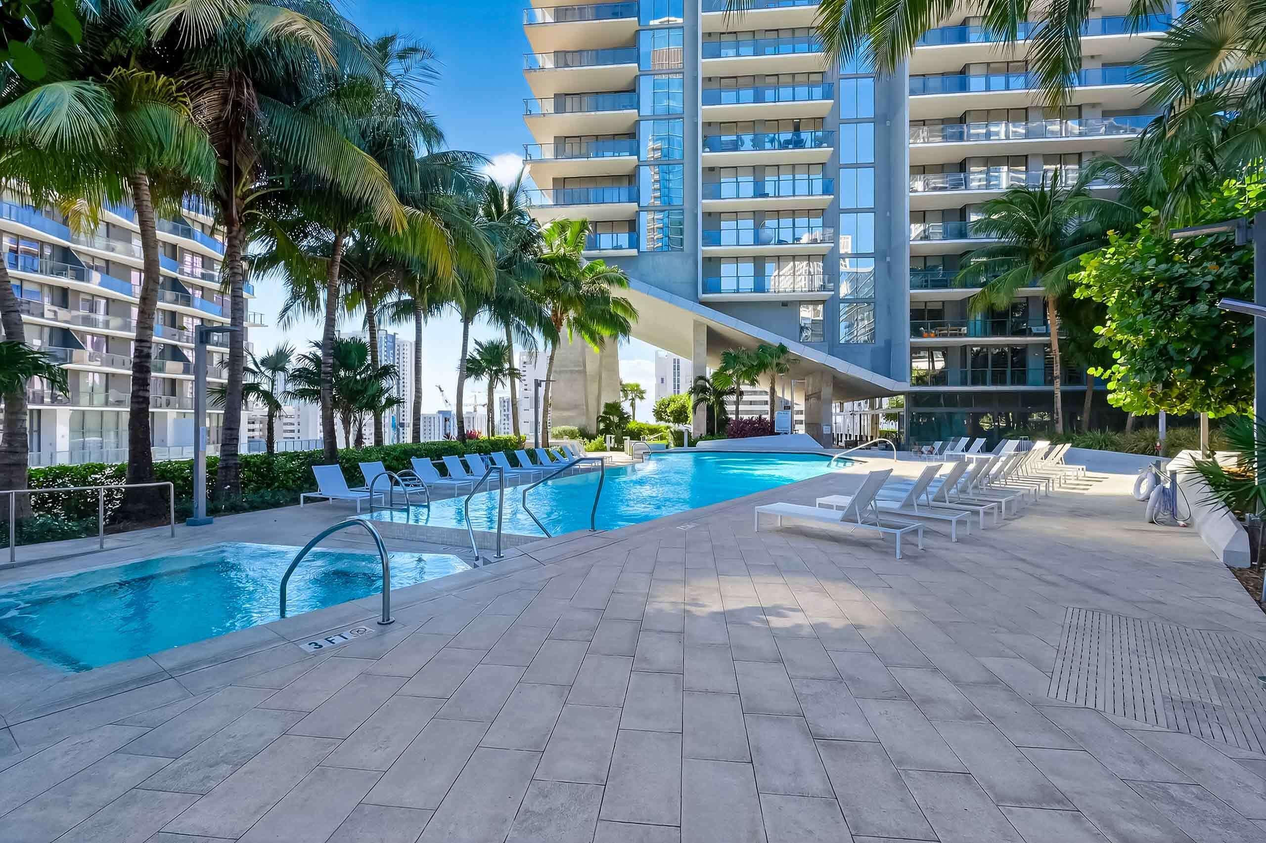 88 Southwest 7th Street, Unit 3003 Miami, FL 33130 - Photo 36 of 49 a view of a swimming pool with a patio