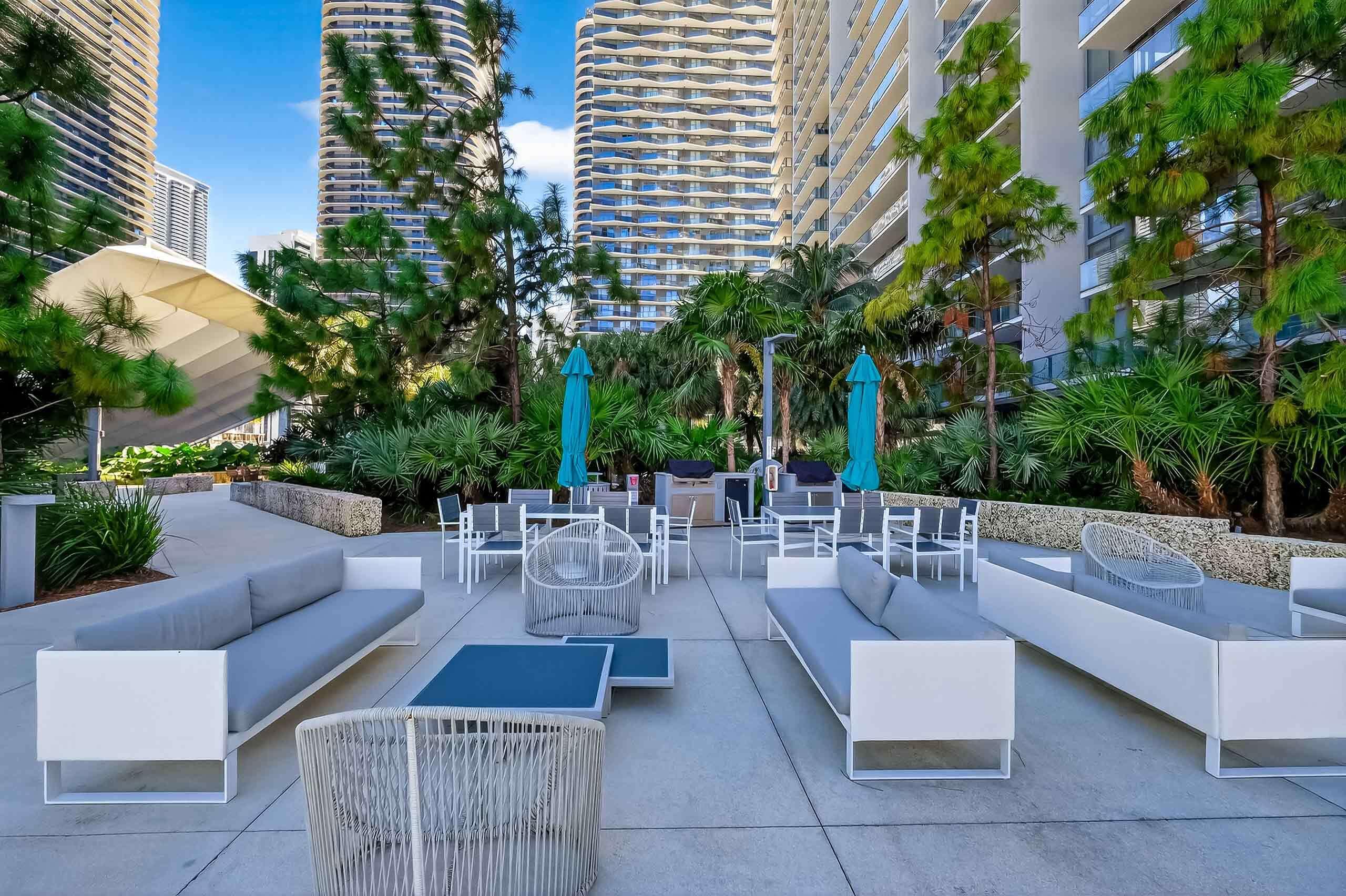 88 Southwest 7th Street, Unit 3003 Miami, FL 33130 - Photo 39 of 49 a view of a patio with couches and potted plants