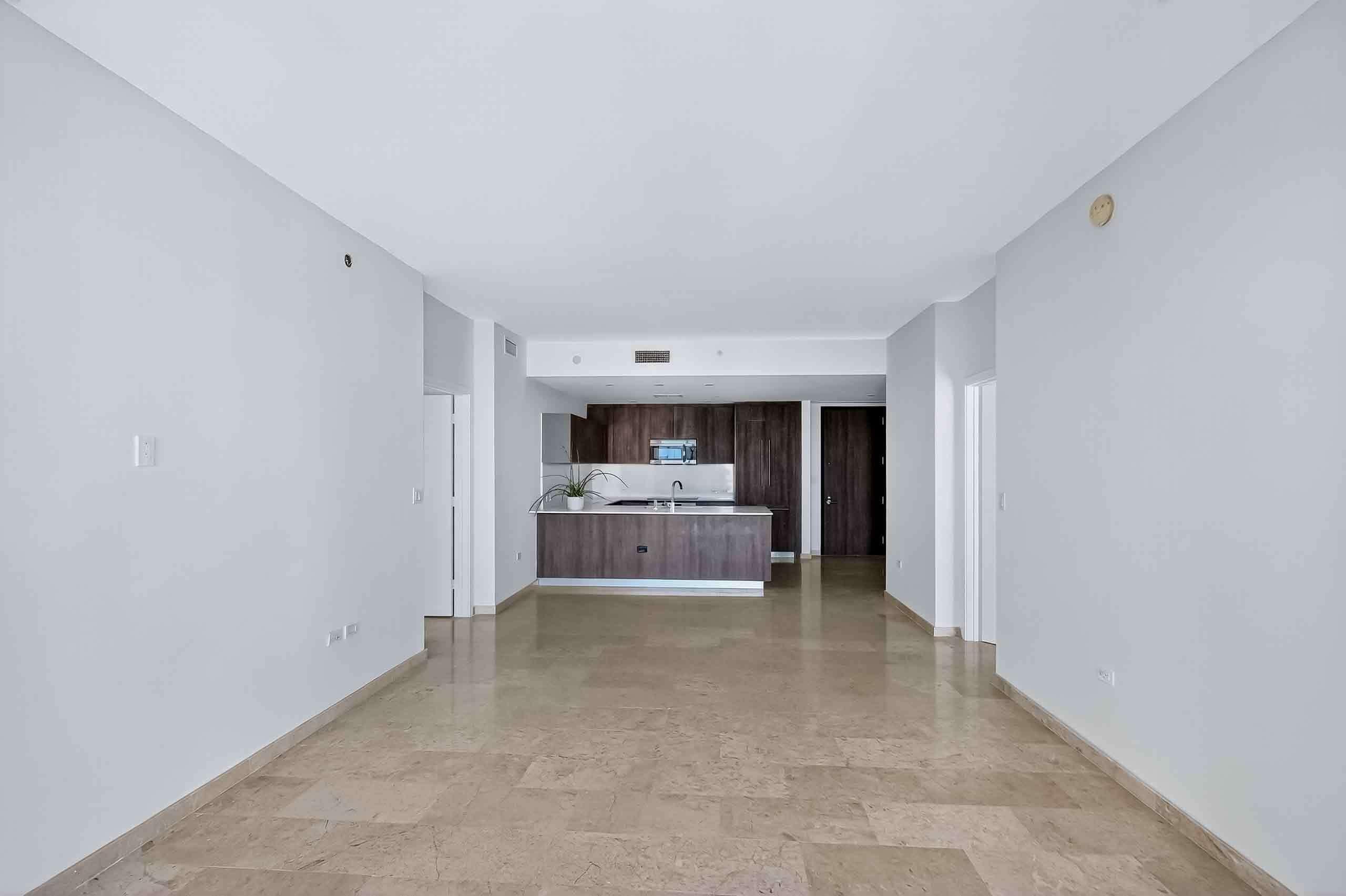 88 Southwest 7th Street, Unit 3003 Miami, FL 33130 - Photo 6 of 49 a view of a livingroom with a flat screen tv wooden floor and a ceiling fan