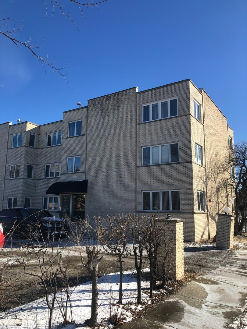 a backyard of a house with barbeque oven