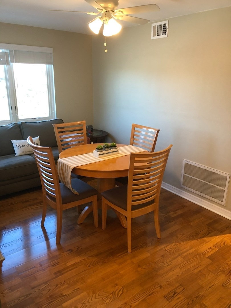 941 North Northwest Highway, Unit 3B Park Ridge, IL 60068 - Photo 10 of 26 a view of a dining room with furniture and wooden floor