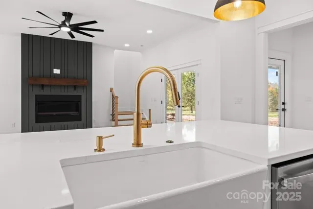 a bathroom with a tub sink and mirror