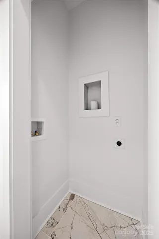 a bathroom with a sink a toilet and a window