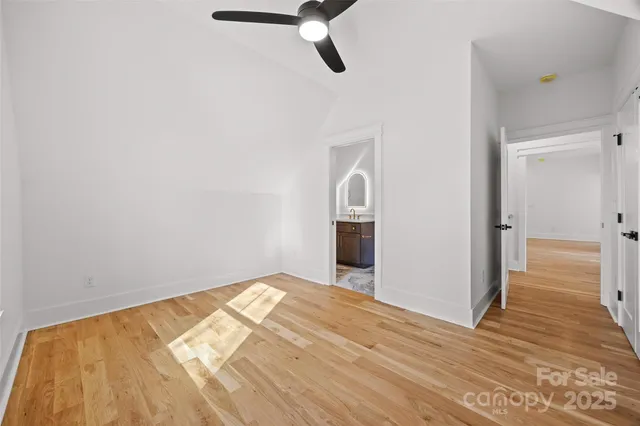 a bathroom with a sink toilet vanity and shower