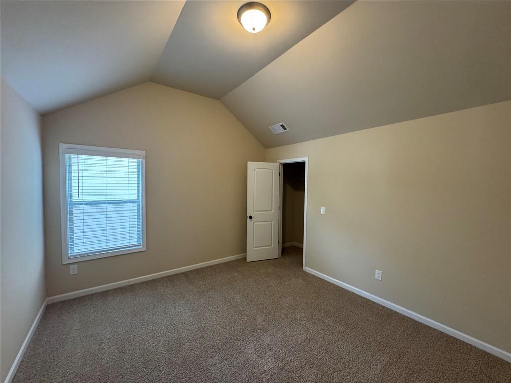 2287 Church Street Hampton, GA 30228 - Photo 11 of 11 an empty room with windows and yard