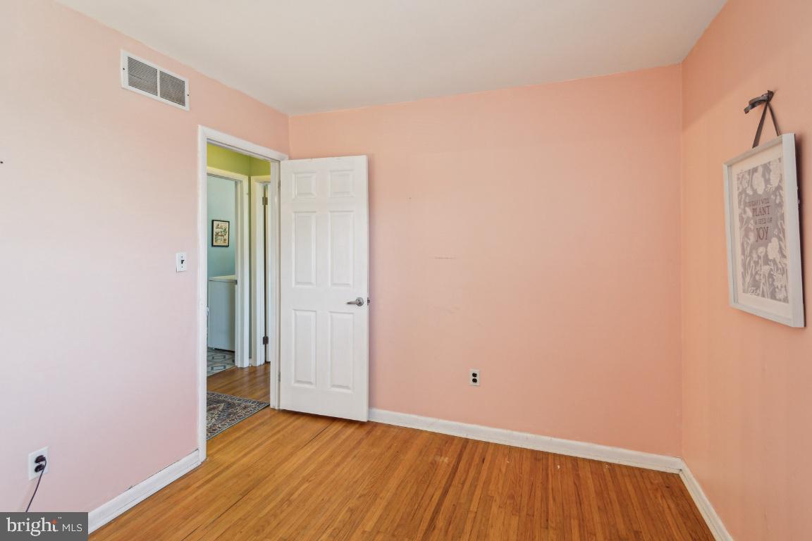 144 Elmtowne Boulevard Hammonton, NJ 08037 - Photo 14 of 25 a view of an empty room with wooden floor