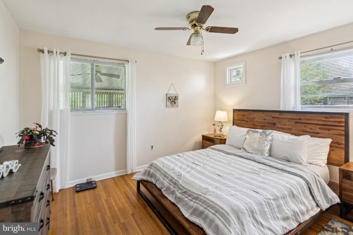 144 Elmtowne Boulevard Hammonton, NJ 08037 - Photo 15 of 25 a bedroom with a bed and wooden floor