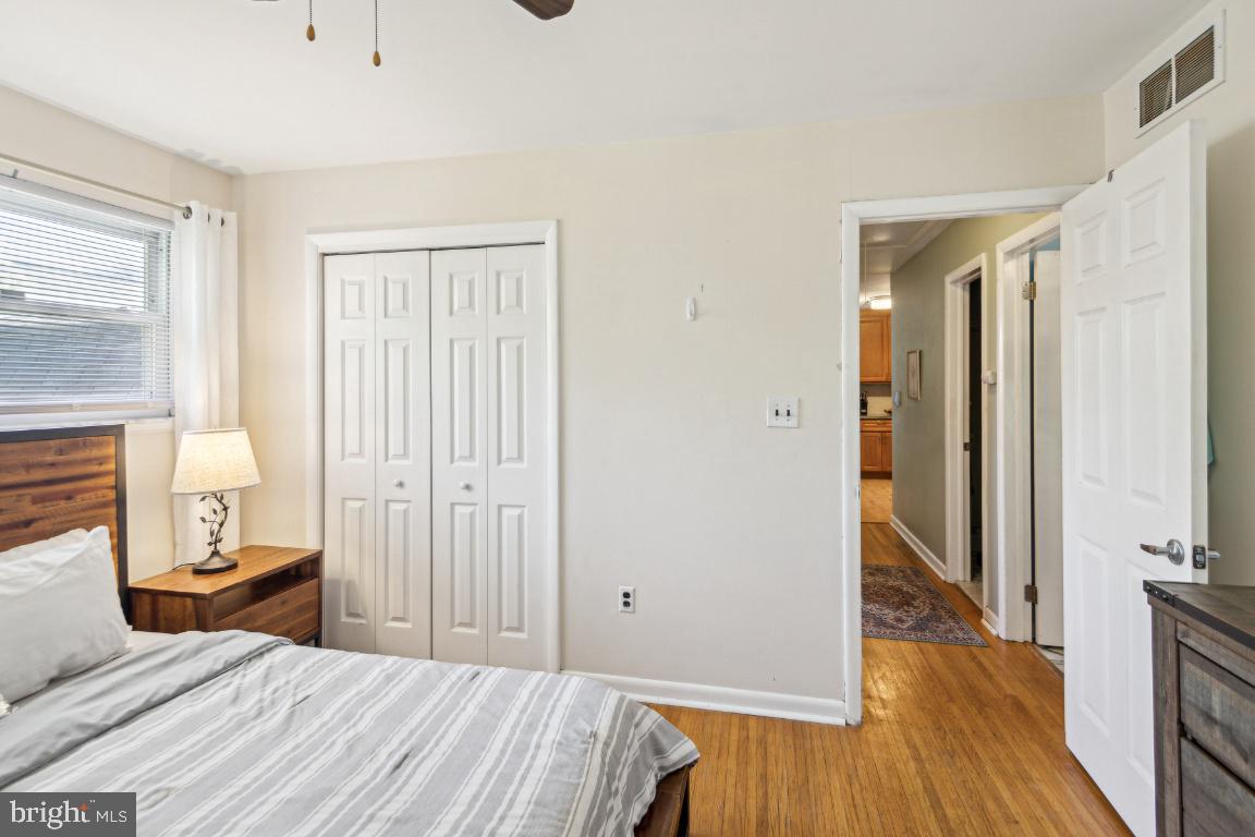 144 Elmtowne Boulevard Hammonton, NJ 08037 - Photo 17 of 25 a bedroom with a bed and wooden floor
