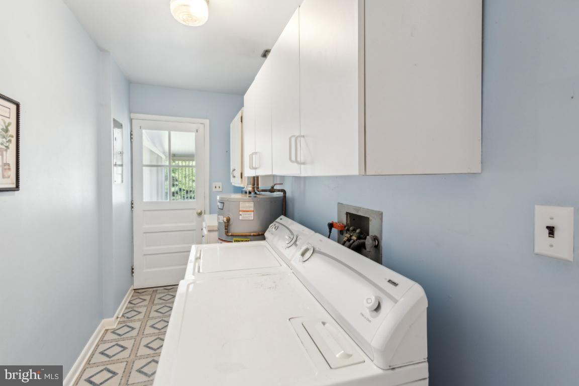 144 Elmtowne Boulevard Hammonton, NJ 08037 - Photo 18 of 25 a view of washer and dryer with bathroom in the background
