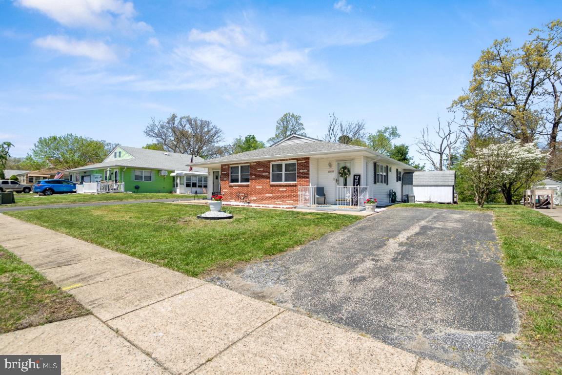 144 Elmtowne Boulevard Hammonton, NJ 08037 - Photo 2 of 25 a view of a house with a big yard and large trees
