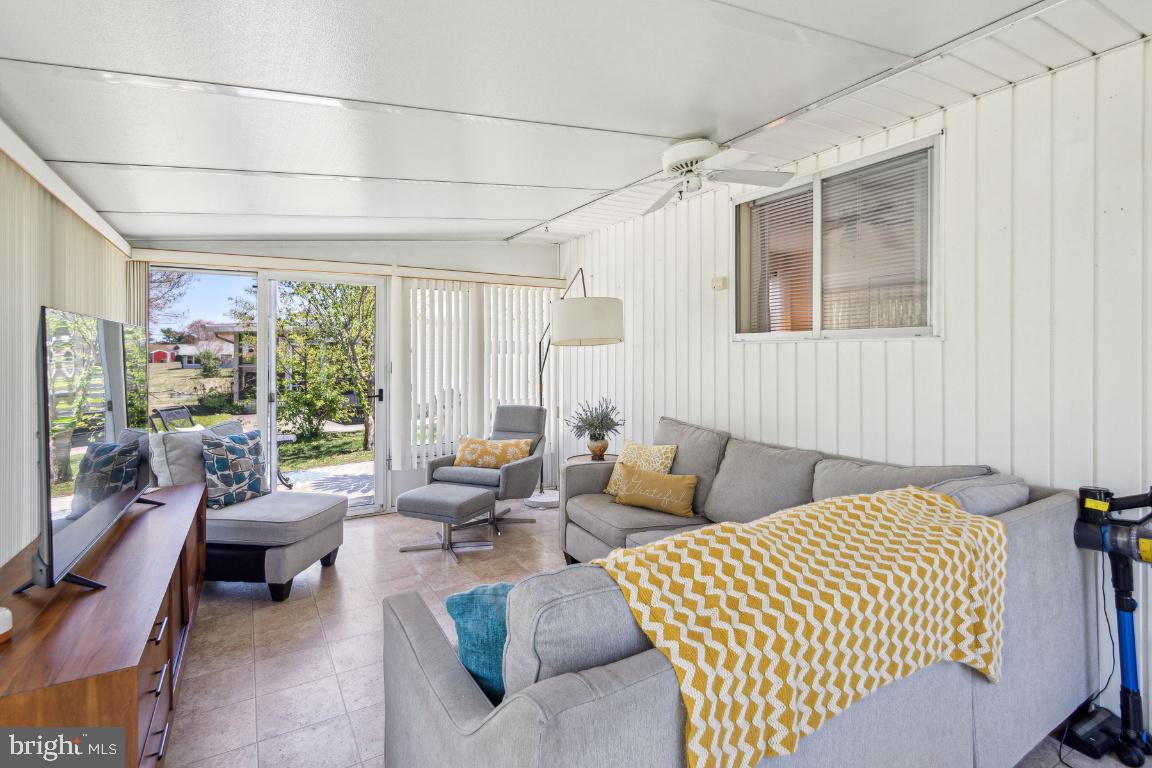 144 Elmtowne Boulevard Hammonton, NJ 08037 - Photo 20 of 25 a living room with furniture and large windows