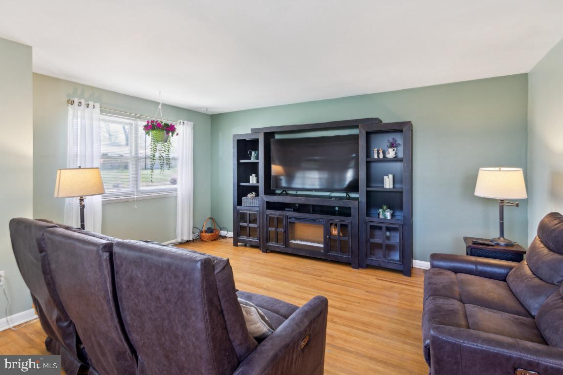 144 Elmtowne Boulevard Hammonton, NJ 08037 - Photo 4 of 25 a living room with furniture and a flat screen tv