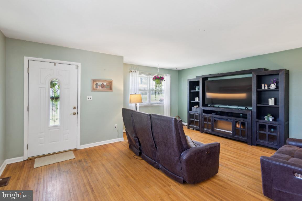 144 Elmtowne Boulevard Hammonton, NJ 08037 - Photo 5 of 25 a living room with furniture and a flat screen tv