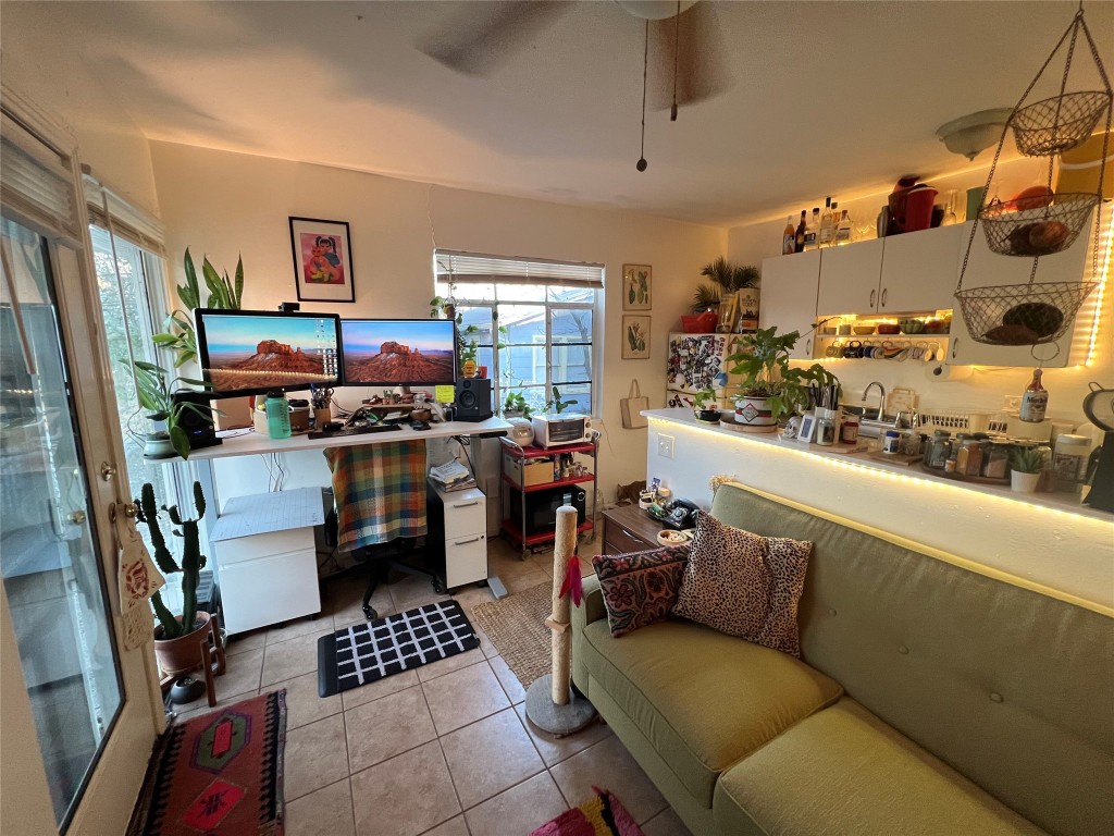3318 Hemlock Avenue, Unit B Austin, TX 78722 - Photo 12 of 12 a room with furniture a rug and a window
