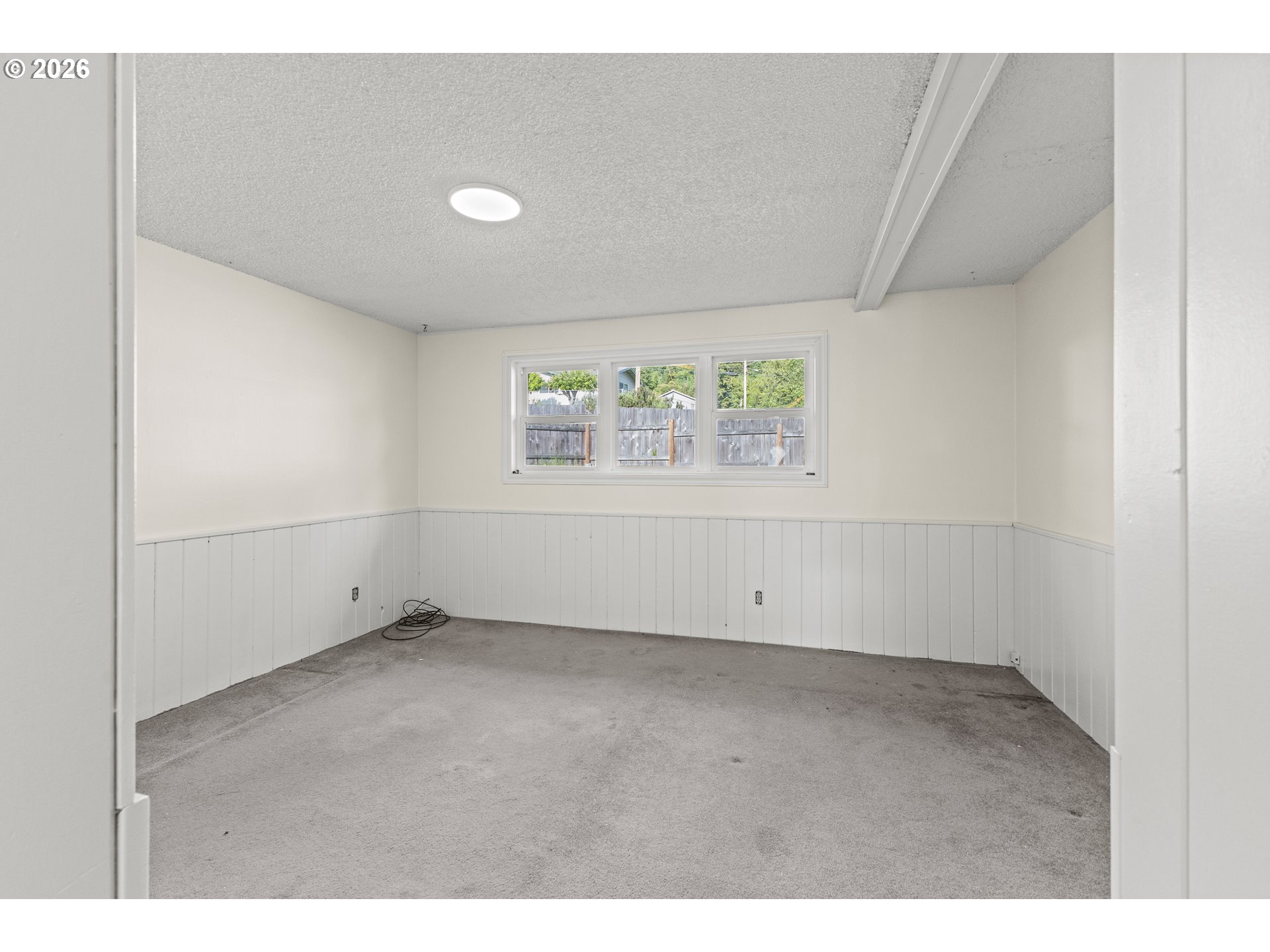 1816 Sunset Court Myrtle Point, OR 97458 - Photo 33 of 42 a view of an empty room with a window