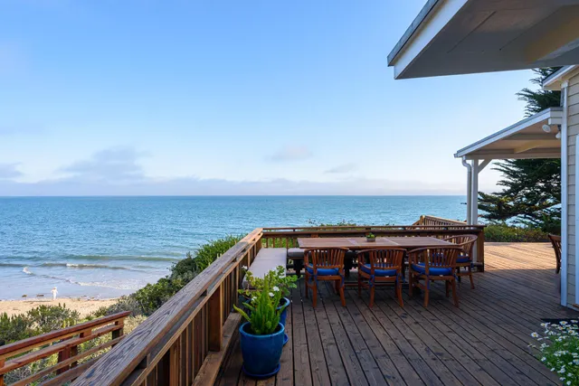 a view of roof deck with patio and wooden floor