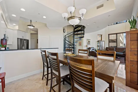 a bedroom with a bed and a flat tv screen on dresser