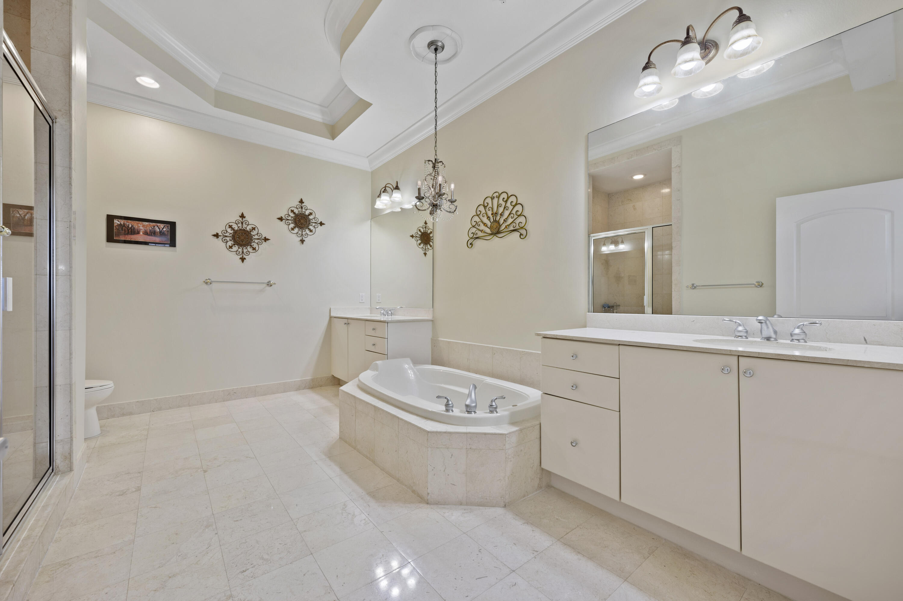801 South Olive Avenue, Unit 416 West Palm Beach, FL 33401 - Photo 19 of 34 a bathroom with a toilet sink and mirror