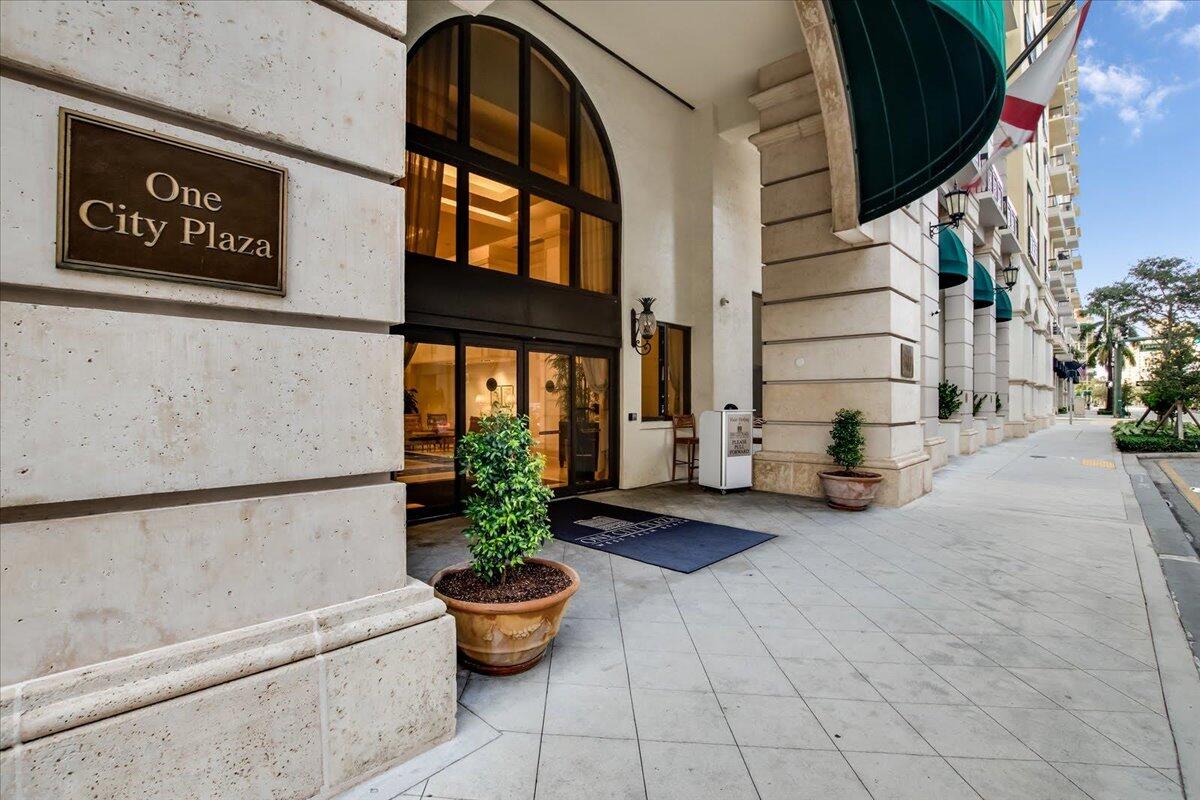 801 South Olive Avenue, Unit 416 West Palm Beach, FL 33401 - Photo 23 of 34 a view of a patio with table and chairs and potted plants