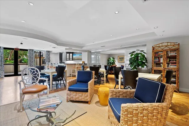 a living room with a couch and a potted plant