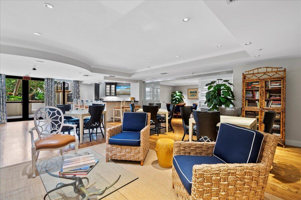 801 South Olive Avenue, Unit 416 West Palm Beach, FL 33401 - Photo 25 of 34 a living room with furniture potted plant and a large window