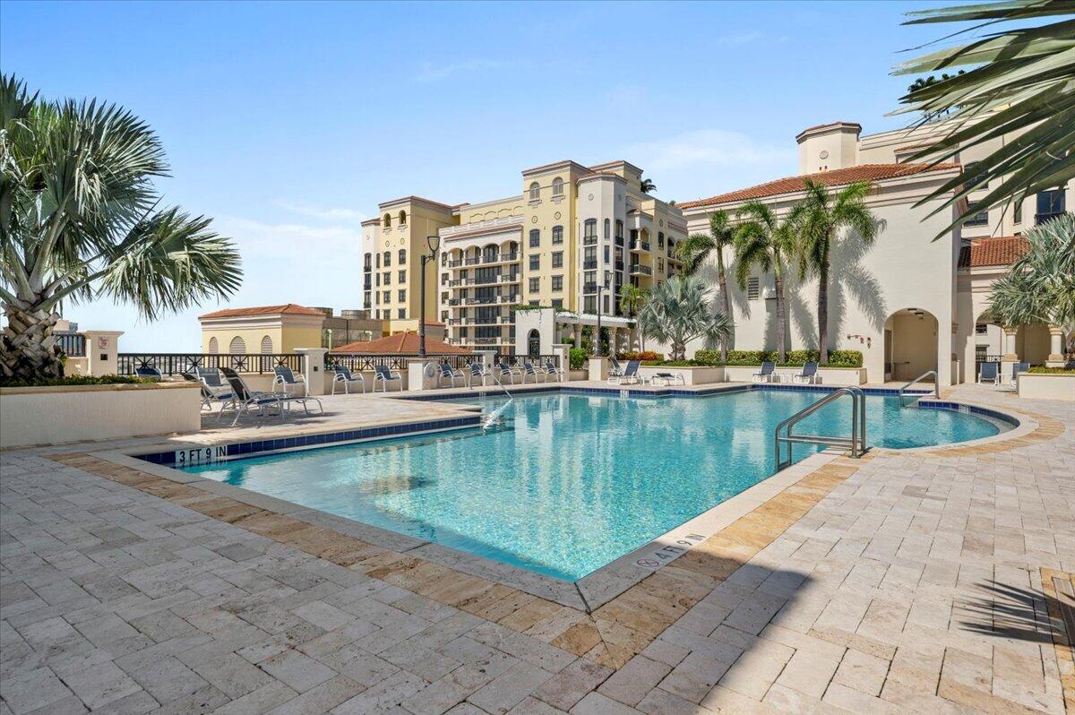 801 South Olive Avenue, Unit 416 West Palm Beach, FL 33401 - Photo 28 of 34 a view of swimming pool with outdoor seating and plants