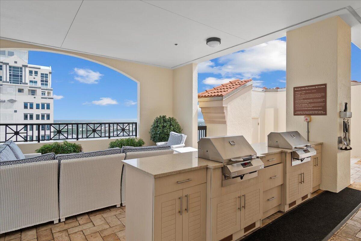 801 South Olive Avenue, Unit 416 West Palm Beach, FL 33401 - Photo 31 of 34 a room with storage and utility