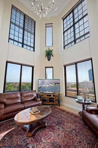 a kitchen with stainless steel appliances granite countertop a sink a stove a microwave and wooden cabinets