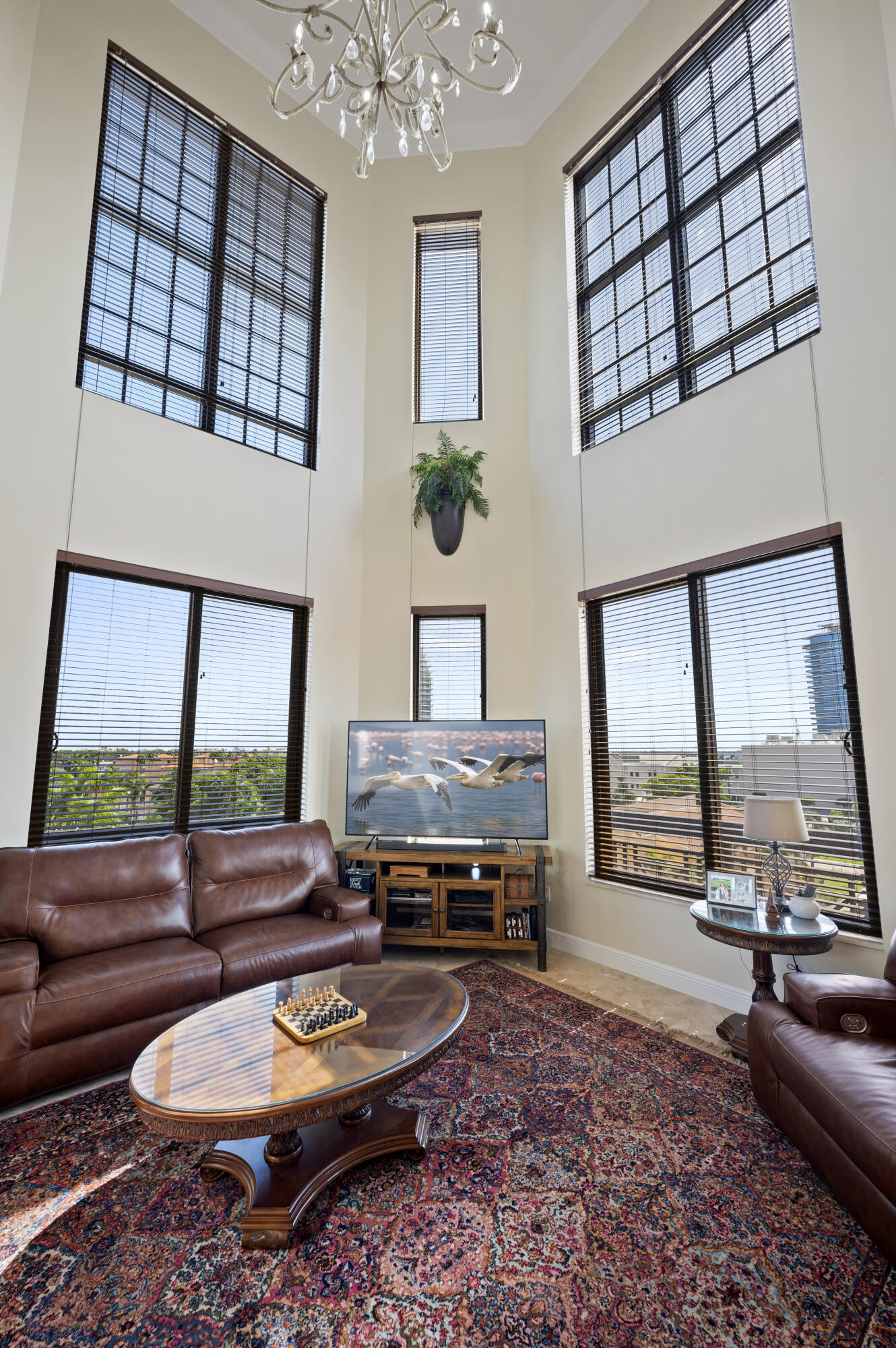 801 South Olive Avenue, Unit 416 West Palm Beach, FL 33401 - Photo 6 of 34 a living room with furniture and a large window