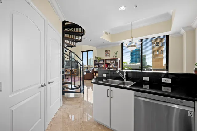 a kitchen with stainless steel appliances a refrigerator and a stove top oven