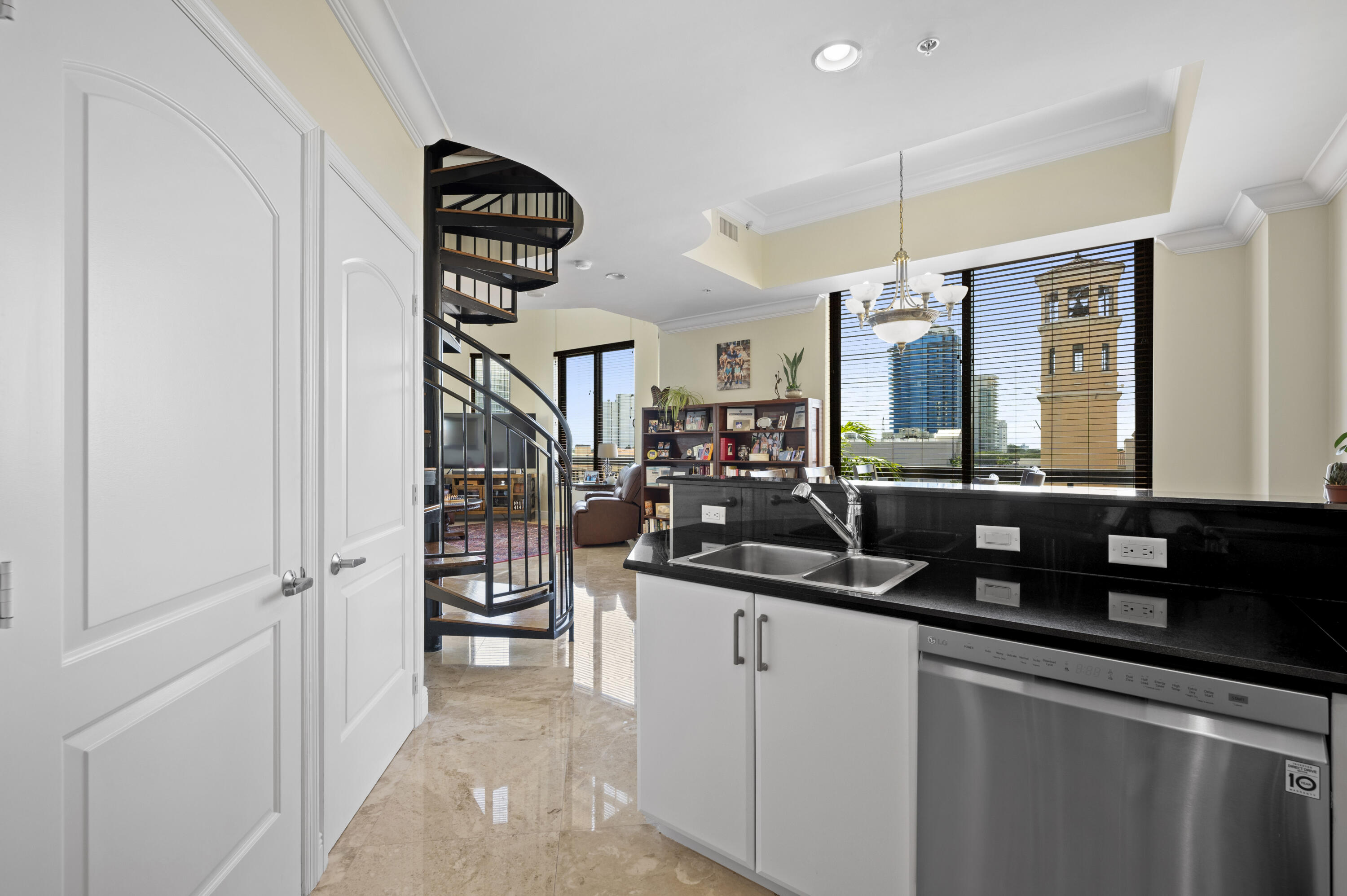 801 South Olive Avenue, Unit 416 West Palm Beach, FL 33401 - Photo 9 of 34 a kitchen with a sink and refrigerator