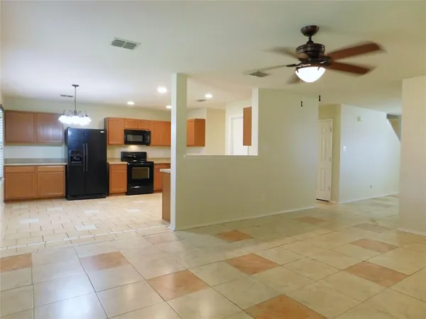 a view of a kitchen with a stove cabinets and a kitchen