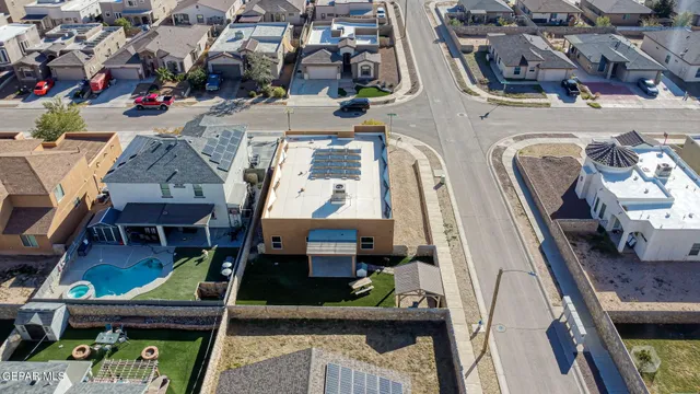 an aerial view of residential houses with outdoor space