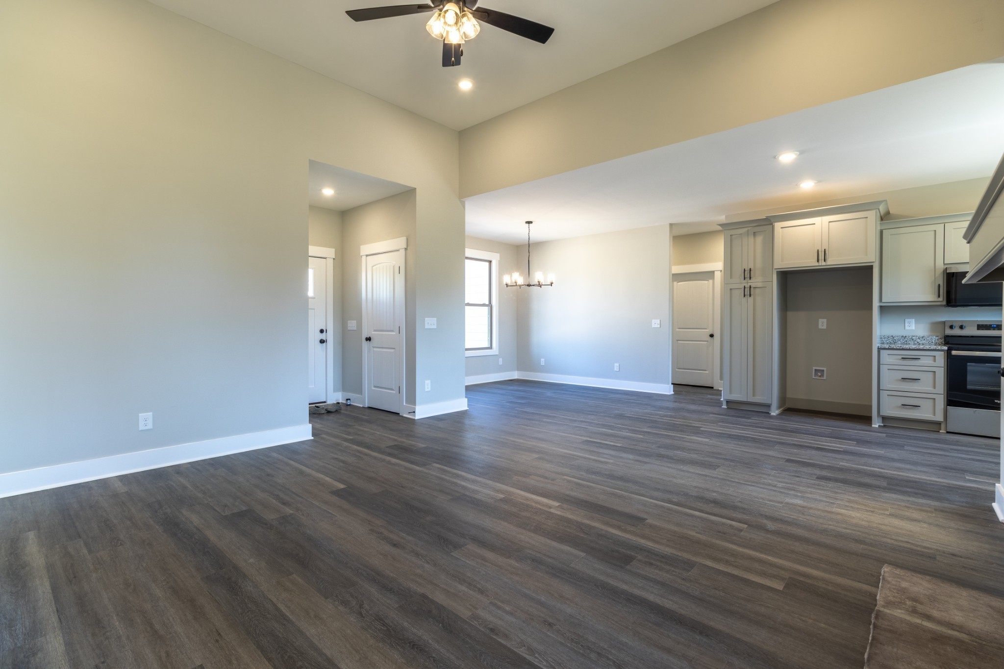 1161 Goose Drive Springfield, TN 37172 - Photo 8 of 19 an empty room with wooden floor chandelier and windows