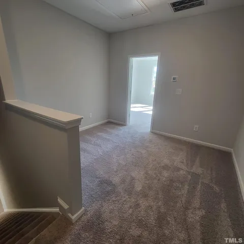 a spacious bathroom with a double vanity sink a mirror and a shower