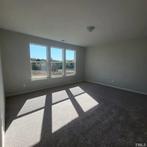 a view of kitchen with cabinets and wooden floor
