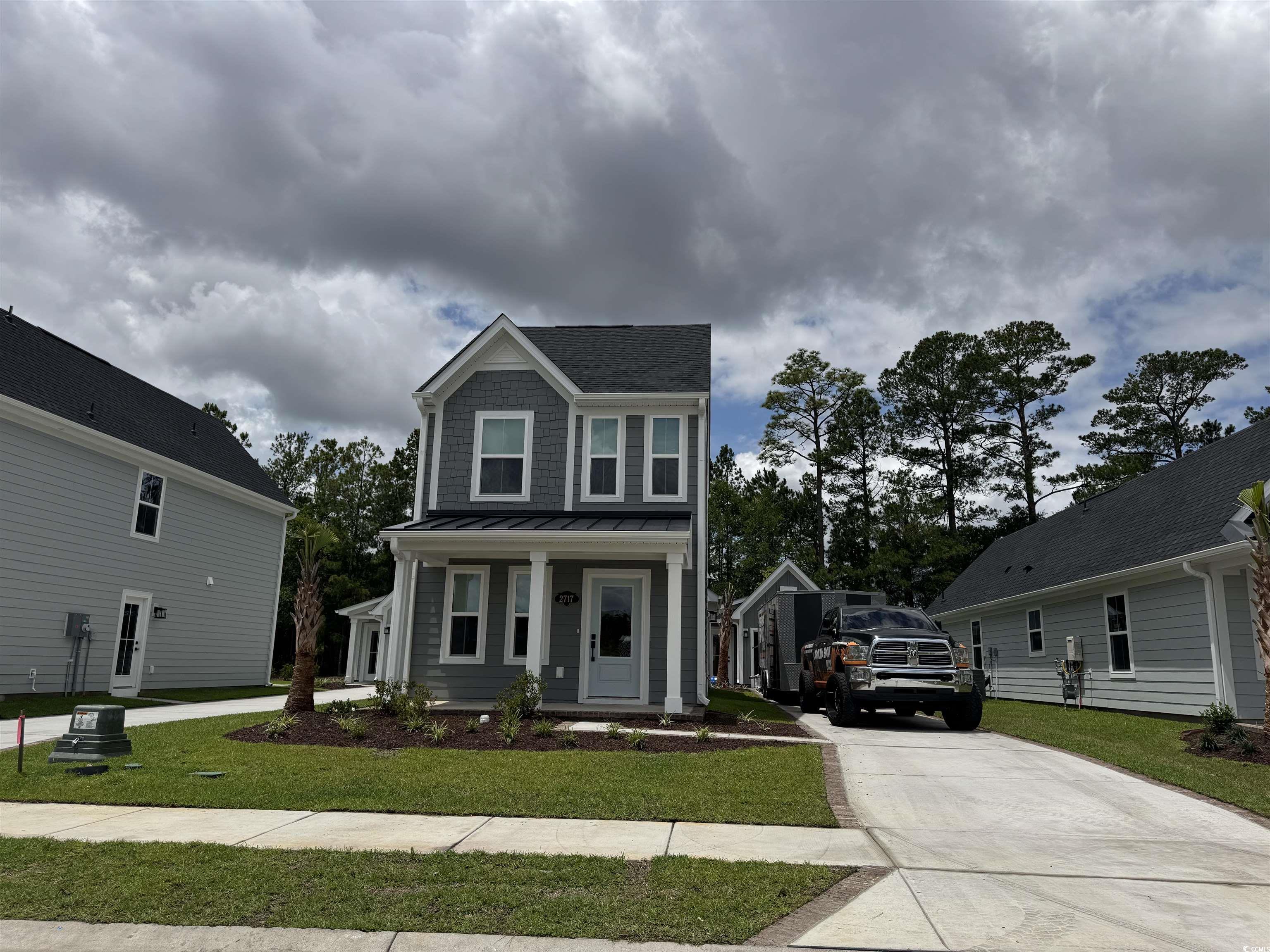 2717 Rowyn Street Longs, SC 29568 - Photo 1 of 1 View of front facade with a standing seam roof, dr