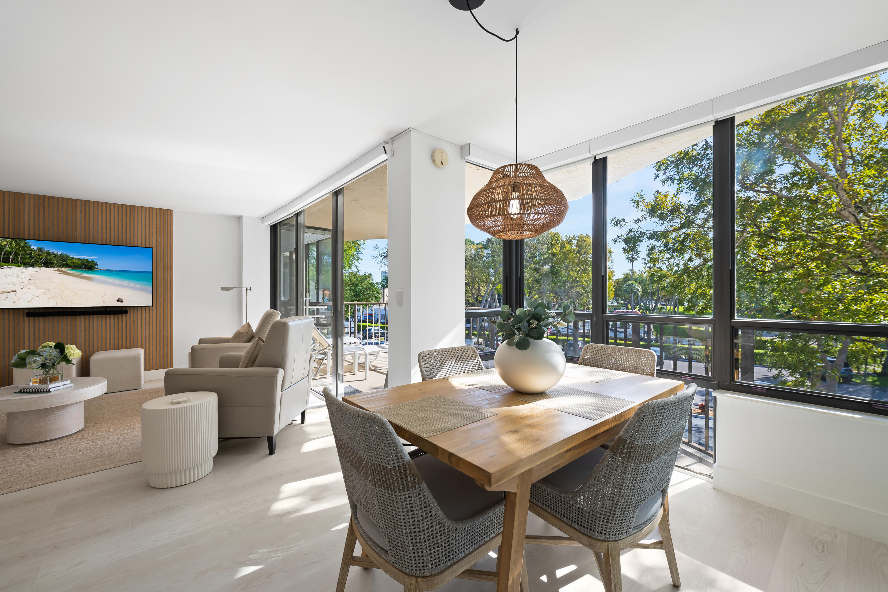799 Jeffery Street, Unit 303 Boca Raton, FL 33487 - Photo 13 of 42 a view of a dining room with furniture large windows and wooden floor
