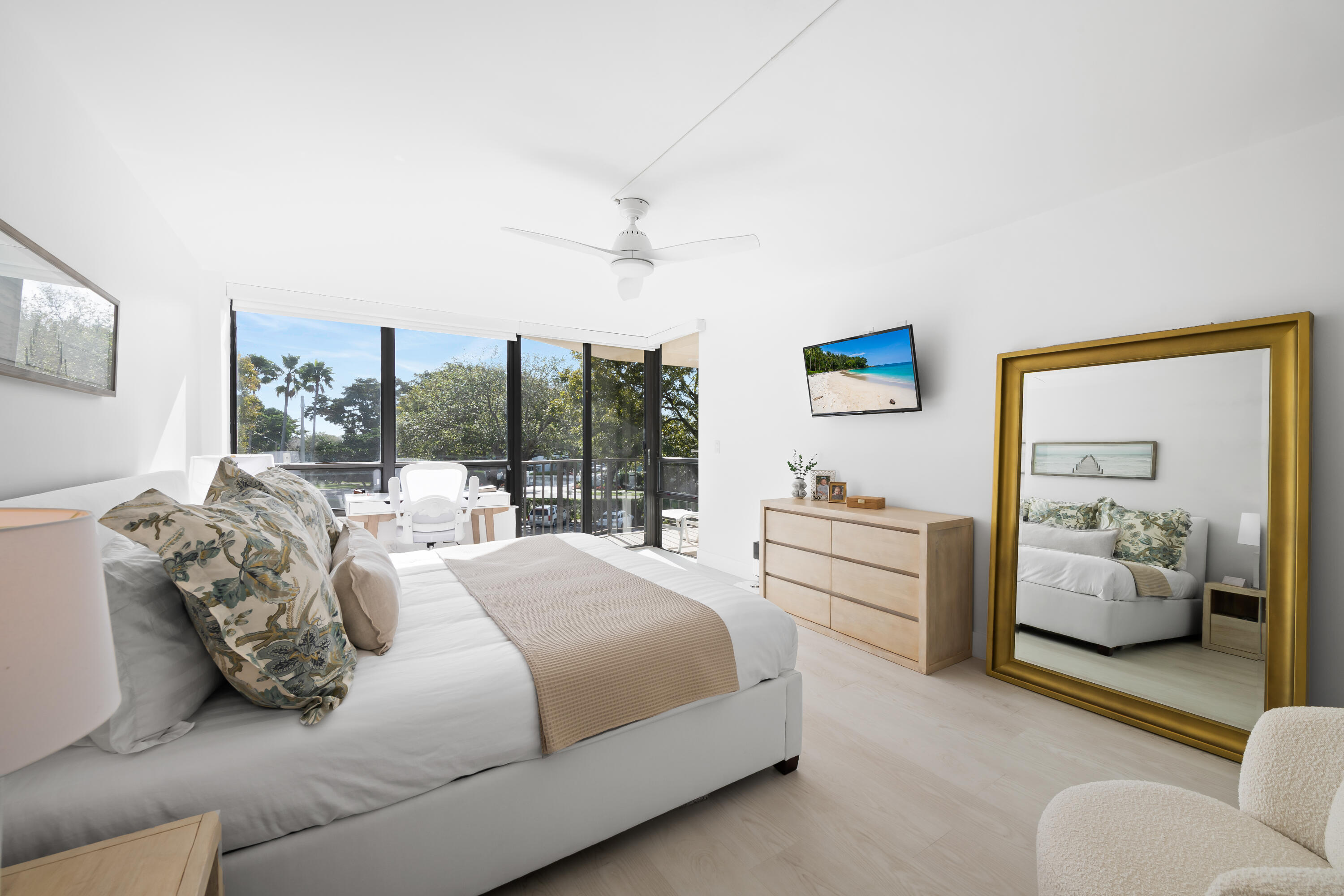 799 Jeffery Street, Unit 303 Boca Raton, FL 33487 - Photo 16 of 42 a bedroom with a bed and a large window