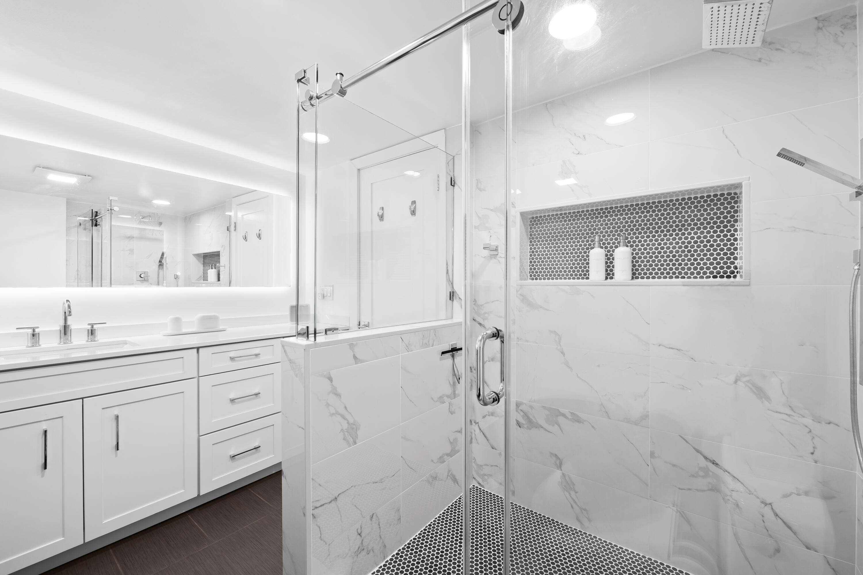799 Jeffery Street, Unit 303 Boca Raton, FL 33487 - Photo 21 of 42 a bathroom with a granite countertop sink mirror and a shower