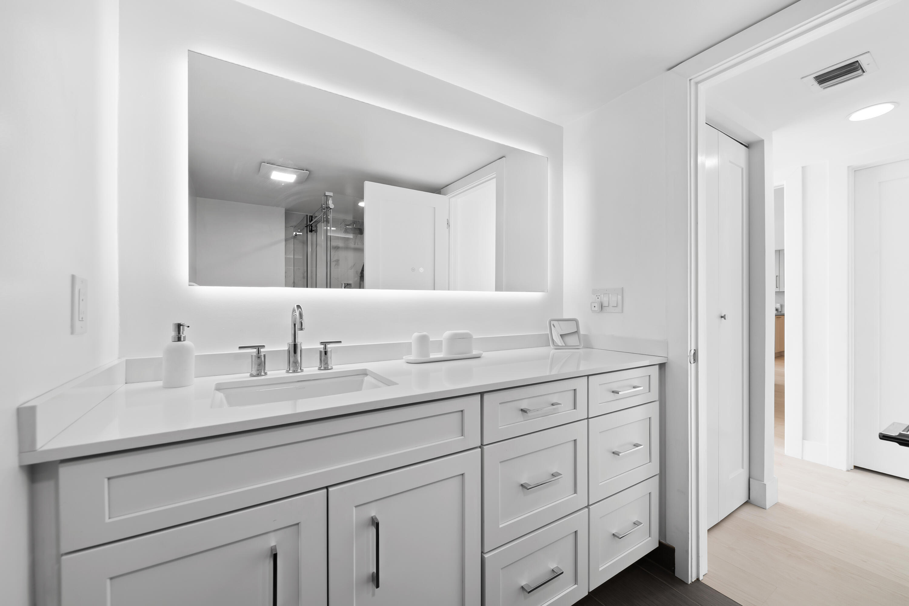 799 Jeffery Street, Unit 303 Boca Raton, FL 33487 - Photo 22 of 42 a bathroom with double sink and a mirror