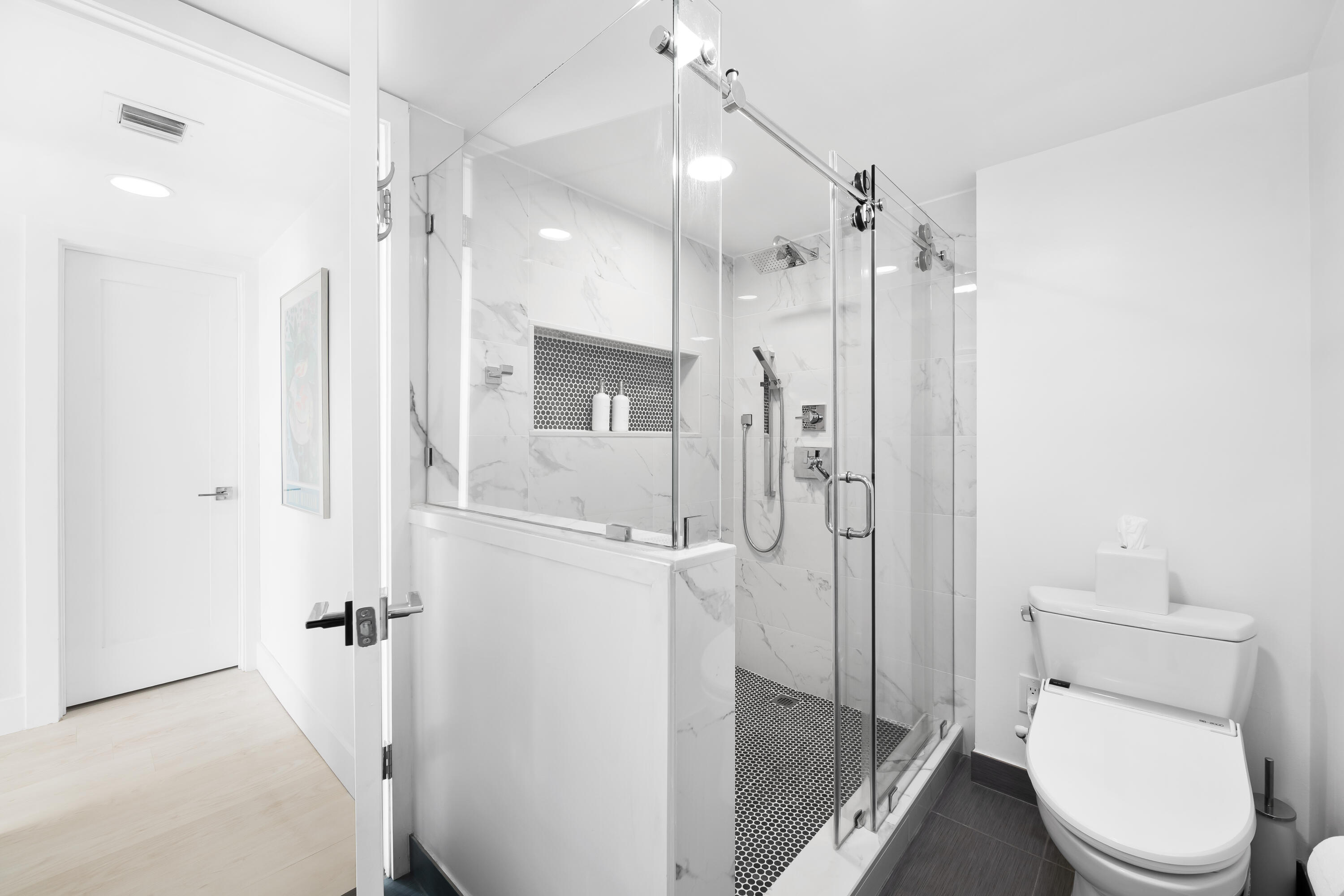 799 Jeffery Street, Unit 303 Boca Raton, FL 33487 - Photo 23 of 42 a bathroom with a shower a toilet and a sink